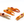 Four ceramic crab claws on a white background